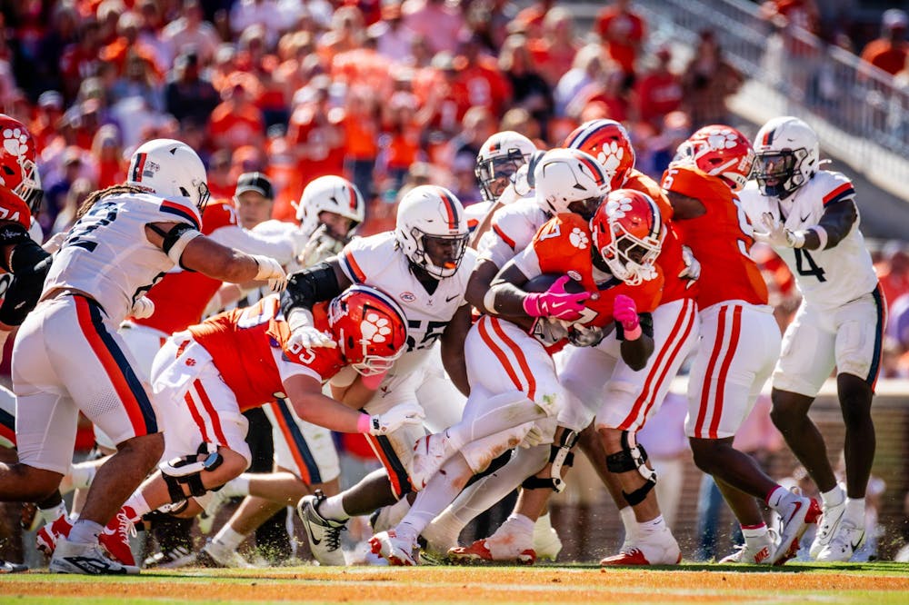 The Cavalier defense stuffs Clemson running back Phil Mafah.
