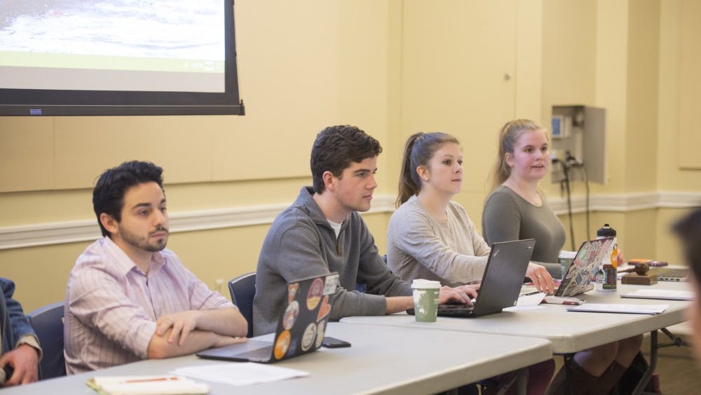 Student Council President-Elect Alex Cintron (left) at Tuesday's meeting. 