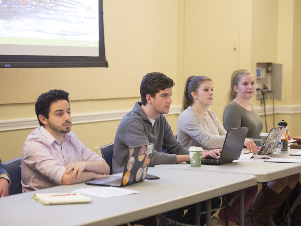 Student Council President-Elect Alex Cintron (left) at Tuesday's meeting. 