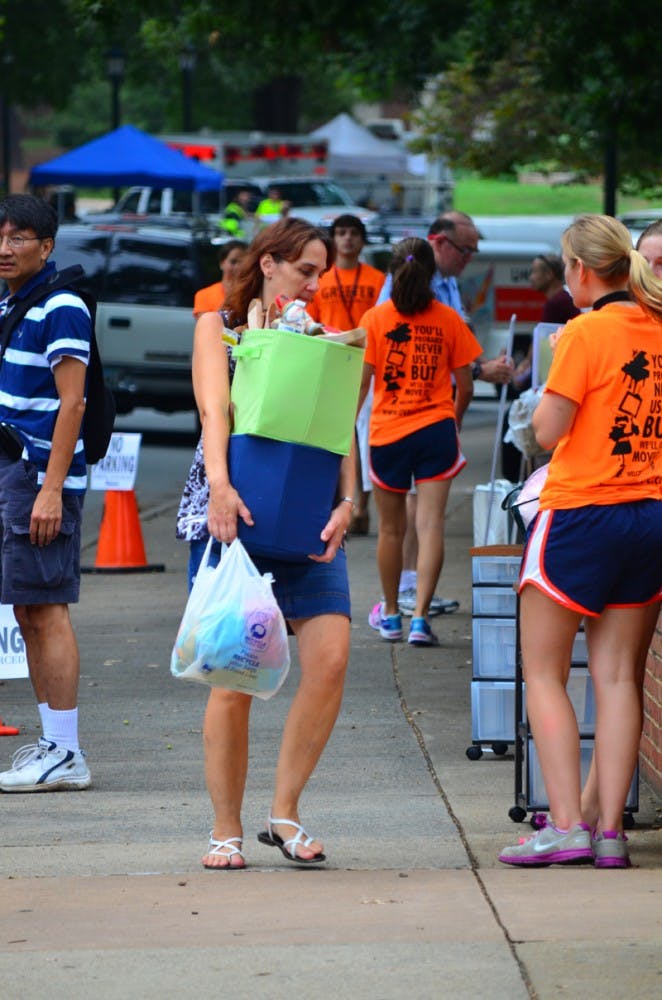 	Bright-eyed, first-year students arrive to dorms festooned with decorations
