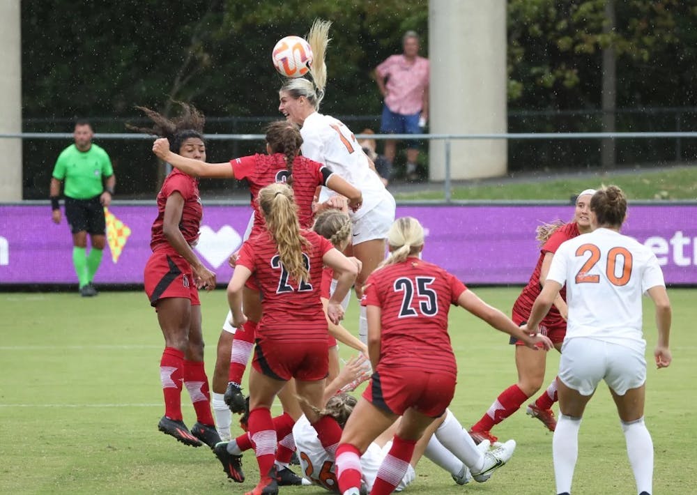 <p>Graduate student Haley Hopkins heads in her 50th career goal late in the game Sunday afternoon.</p>