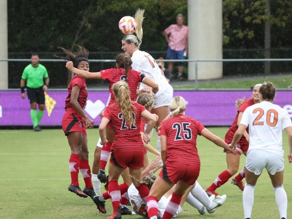 Graduate student Haley Hopkins heads in her 50th career goal late in the game Sunday afternoon.