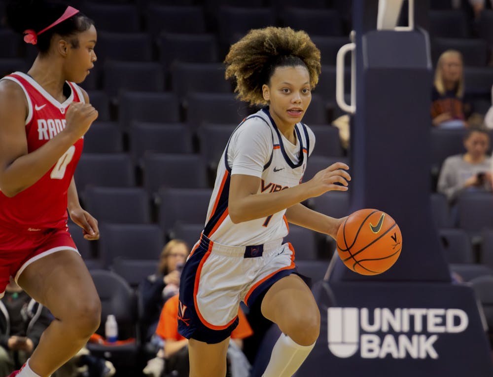 Junior guard Paris Clark runs the Cavalier offense up the court.