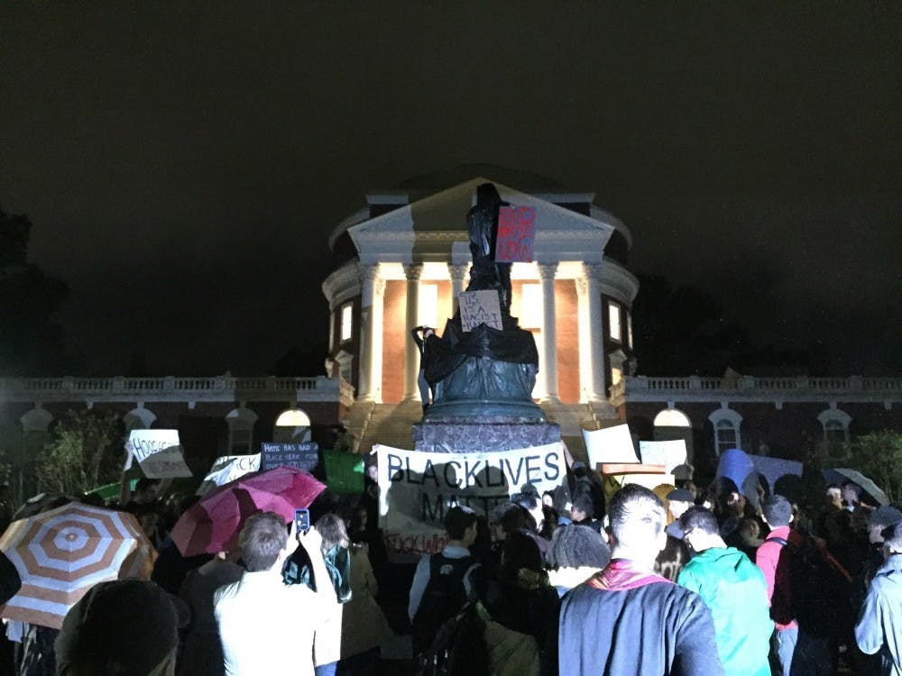 <p>U.Va. student protesters covered the Thomas Jefferson statue in front of the Rotunda, many of whom called for its removal.&nbsp;</p>