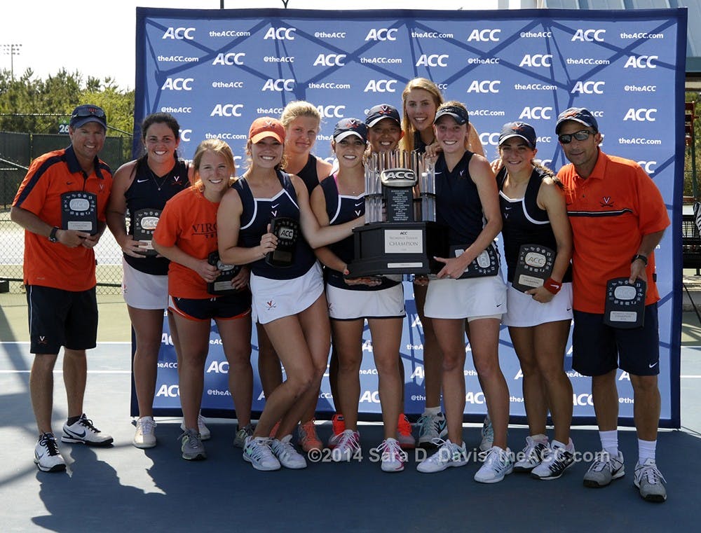 The Virginia women celebrate their  2014 ACC Women's Tennis Championship in Cary, N.C., April 27, 2014. Virginia won 4-2 over Duke. (Photo by Sara D. Davis, theACC.com)