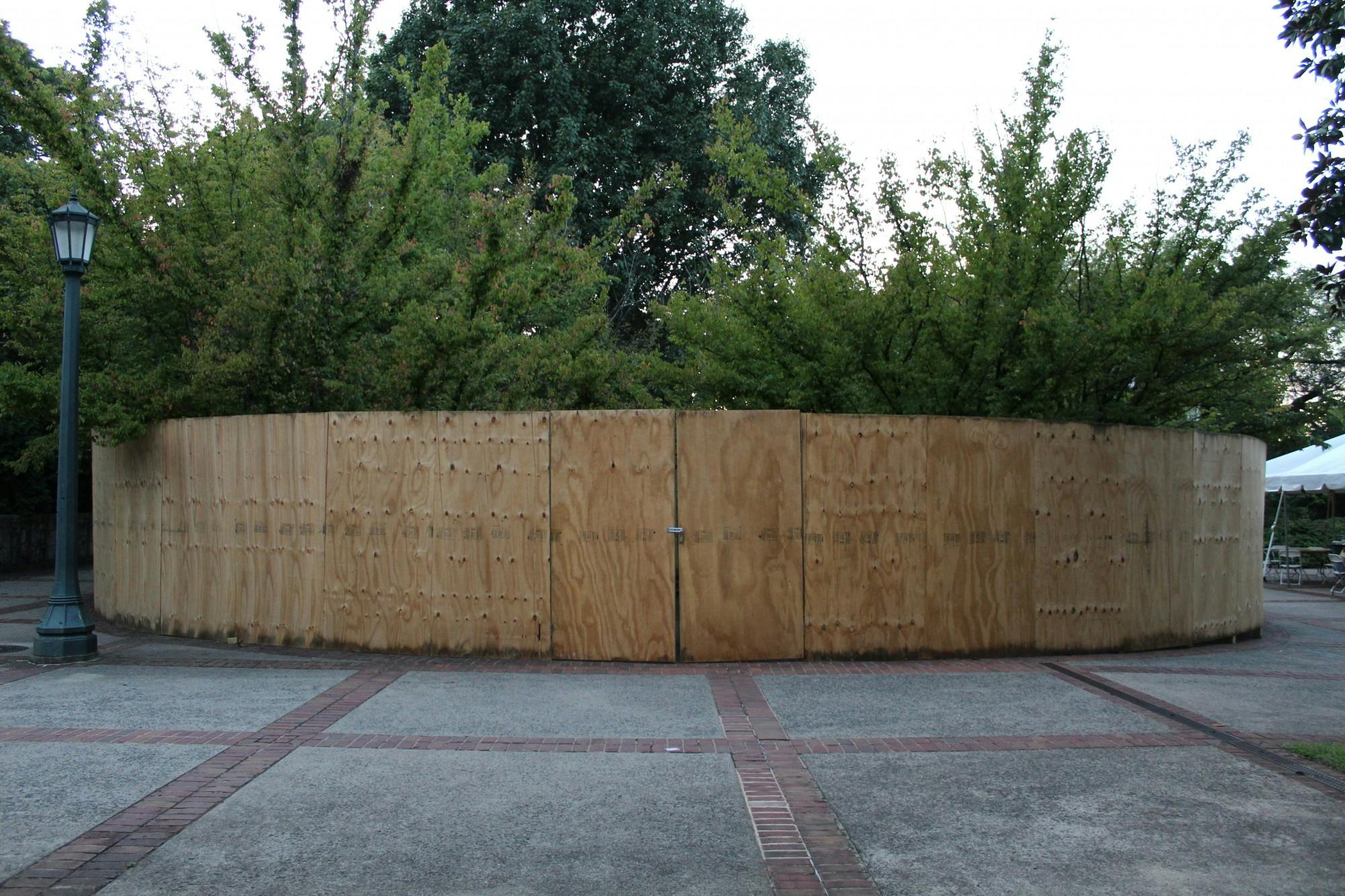 
University spokesperson Wes Hester said the fence will be painted dark green soon — the fence is meant to surround the memorial only temporarily while the University reviews options for a replacement stone. 