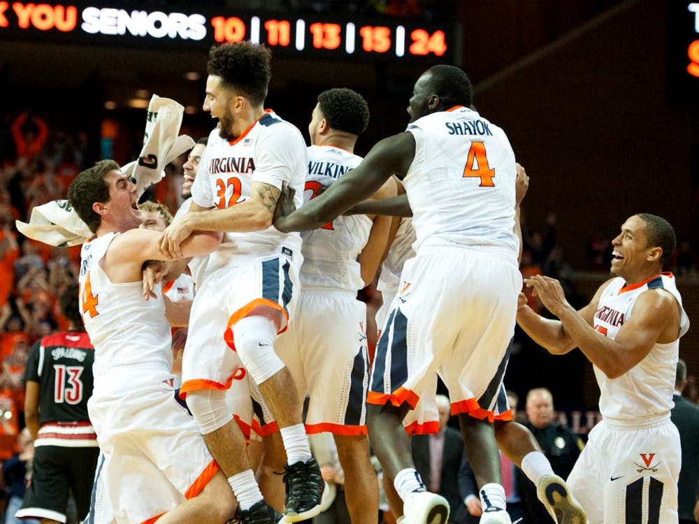 The Virginia basketball team celebrates their 68-46 win over No. 11 Louisville. The Cavaliers finished with a perfect 15-0 record at home. Virginia last went undefeated at home in the 1981-82 season.