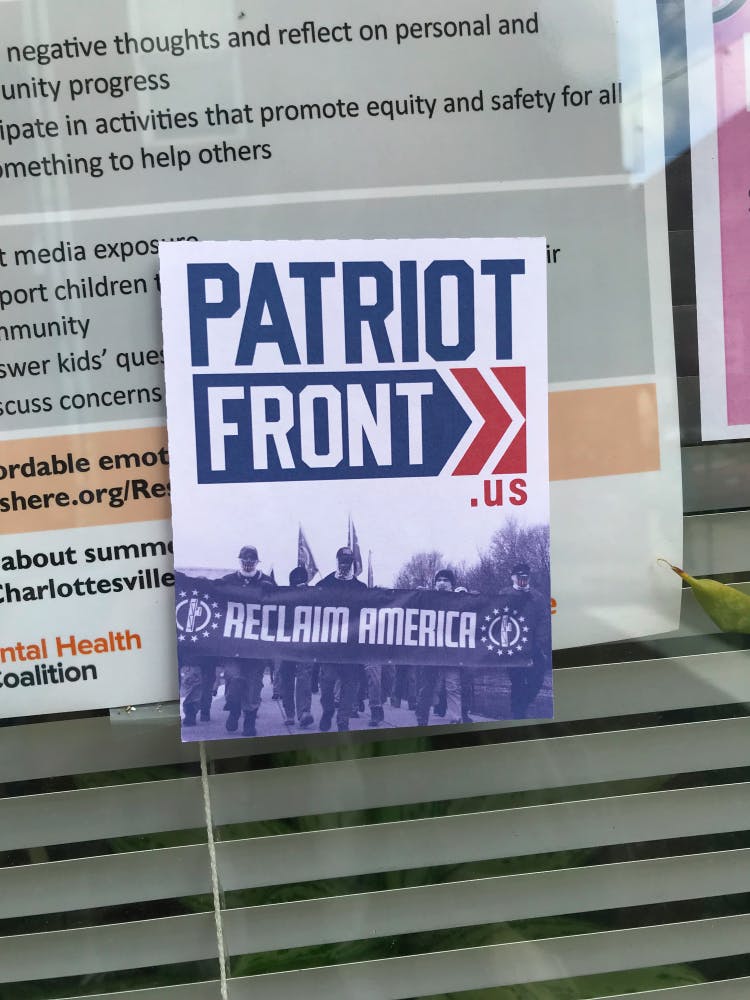 As of Monday evening, the flyers around Heather Heyer Way had been destroyed and replaced with anti-fascist stickers.