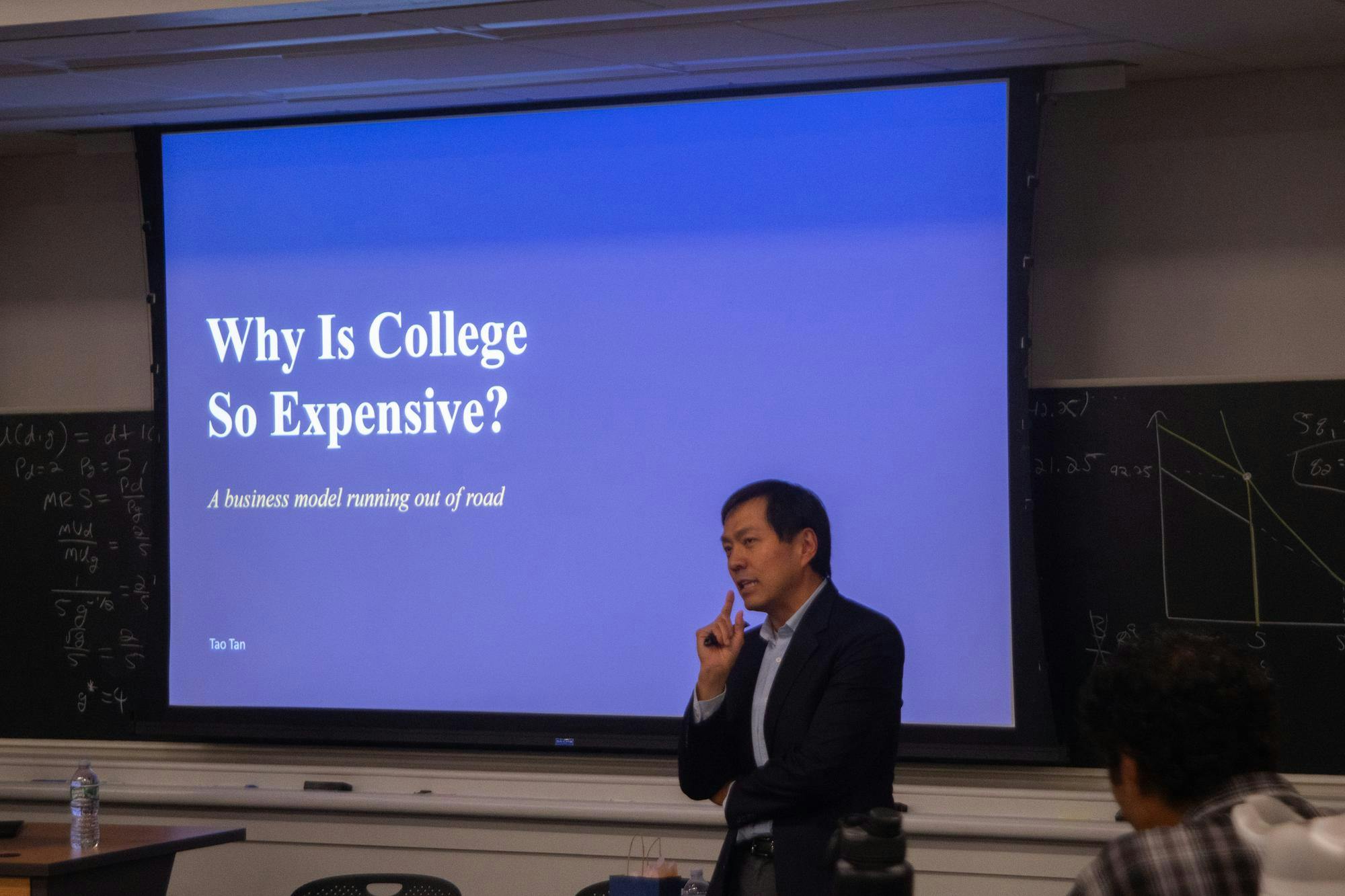 Tao Tan presented on rising college tuition costs at a Blue Ridge Center event Monday evening.