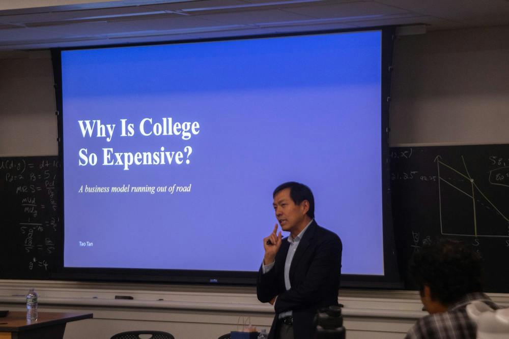 Tao Tan presented on rising college tuition costs at a Blue Ridge Center event Monday evening.