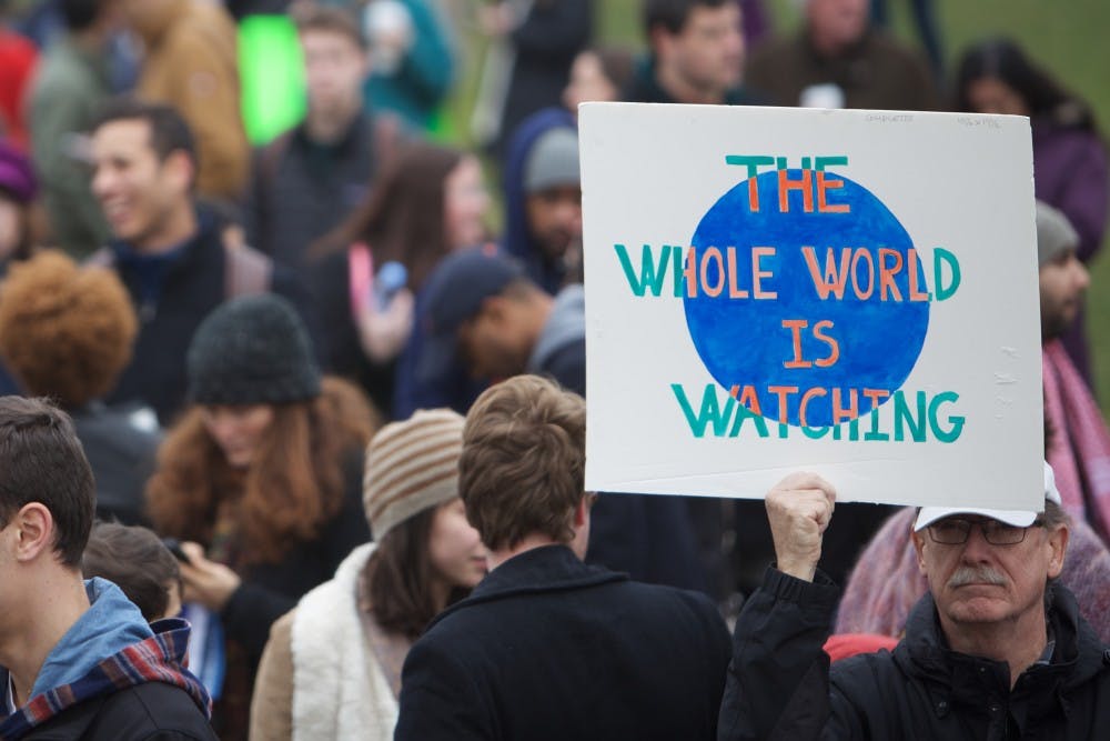 DREAMers on Grounds and the Minority Rights Coalition hosted a rally in protest of President Trump's executive order signed Fridaybarring refugees and those traveling from seven Muslim-majority countries from entering the United States. After numerous speakers on the steps of the Rotunda, between 400 to 500 participants marched down the Lawn, past the Amphitheater and up McCormick Road in front of Alderman Library.
