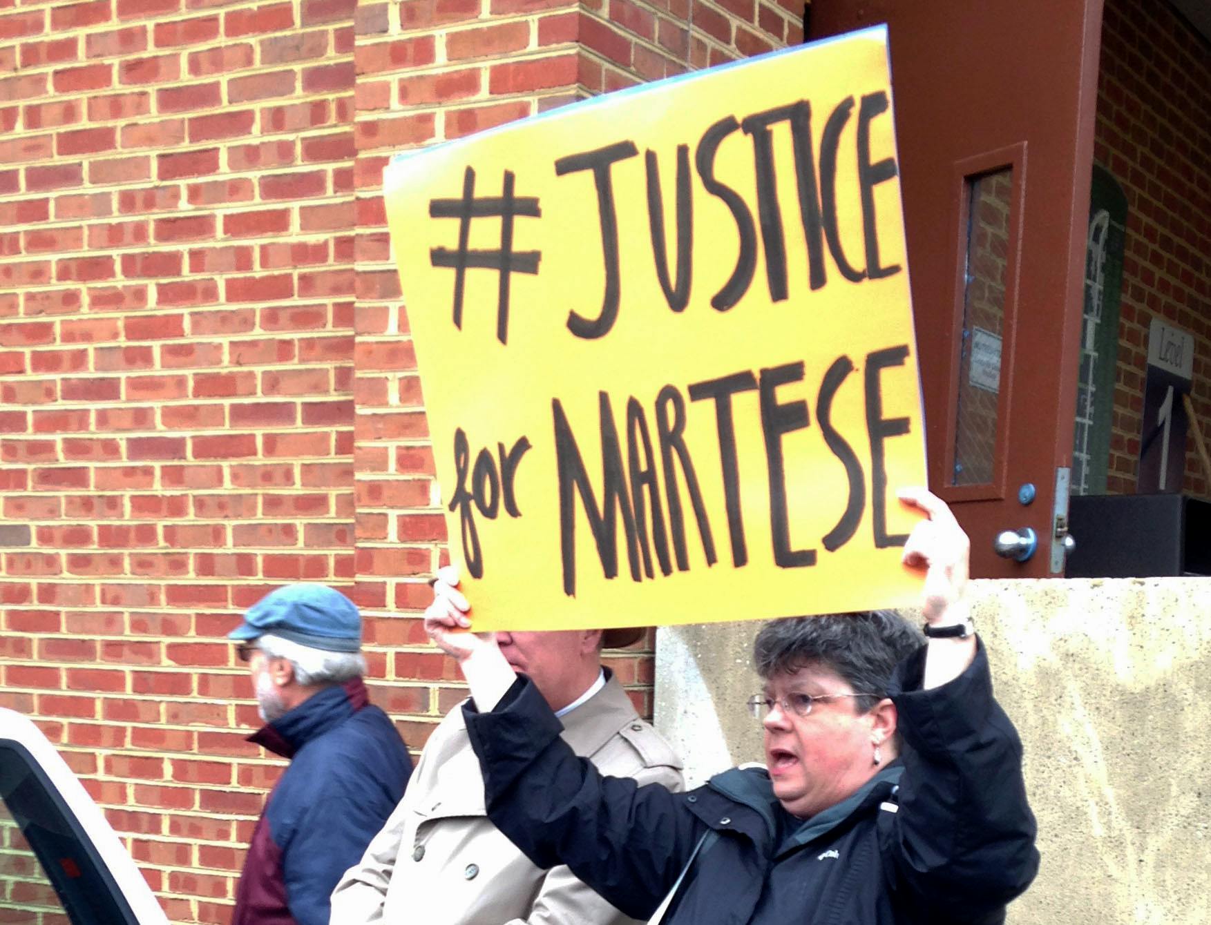 A Charlottesville community member outside the courthouse at one of Johnson's hearing.&nbsp;
