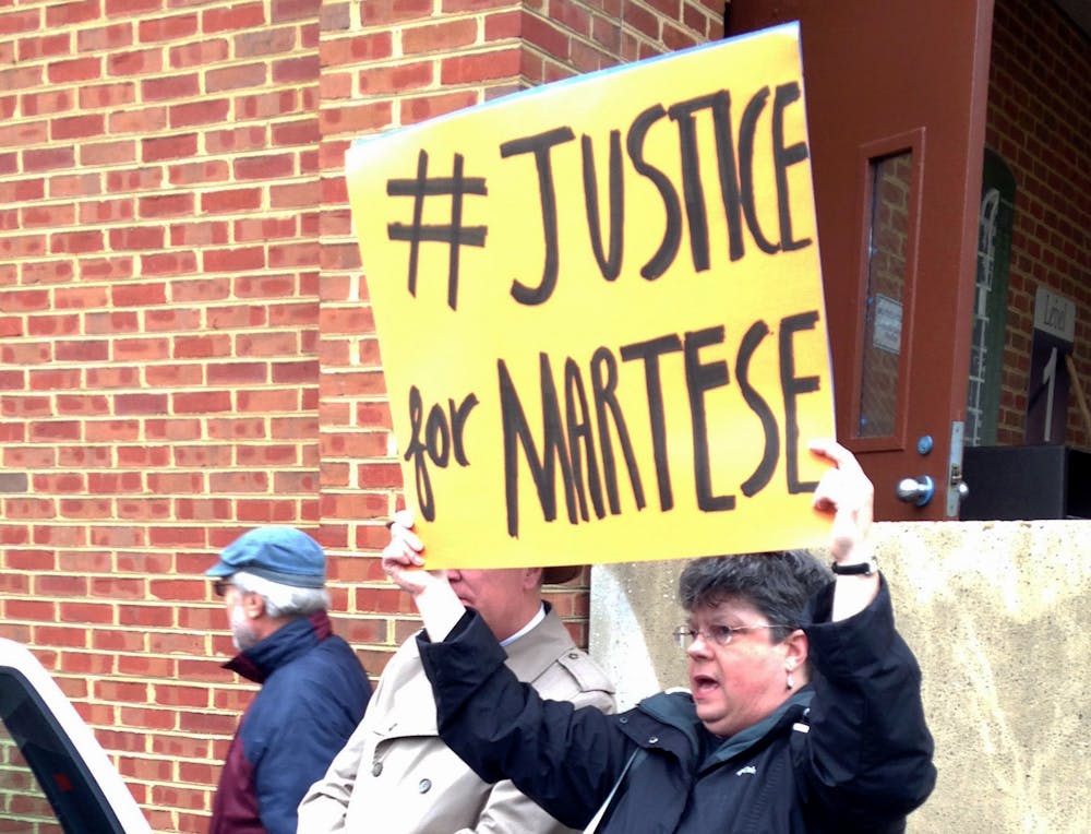 <p>A Charlottesville community member outside the courthouse at one of Johnson's hearing.&nbsp;</p>