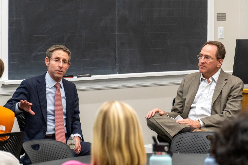 Daniel Bress, left, and Gerard Alexander, right, photographed Feb. 10 during immigration law event hosted by the Blue Ridge Center.