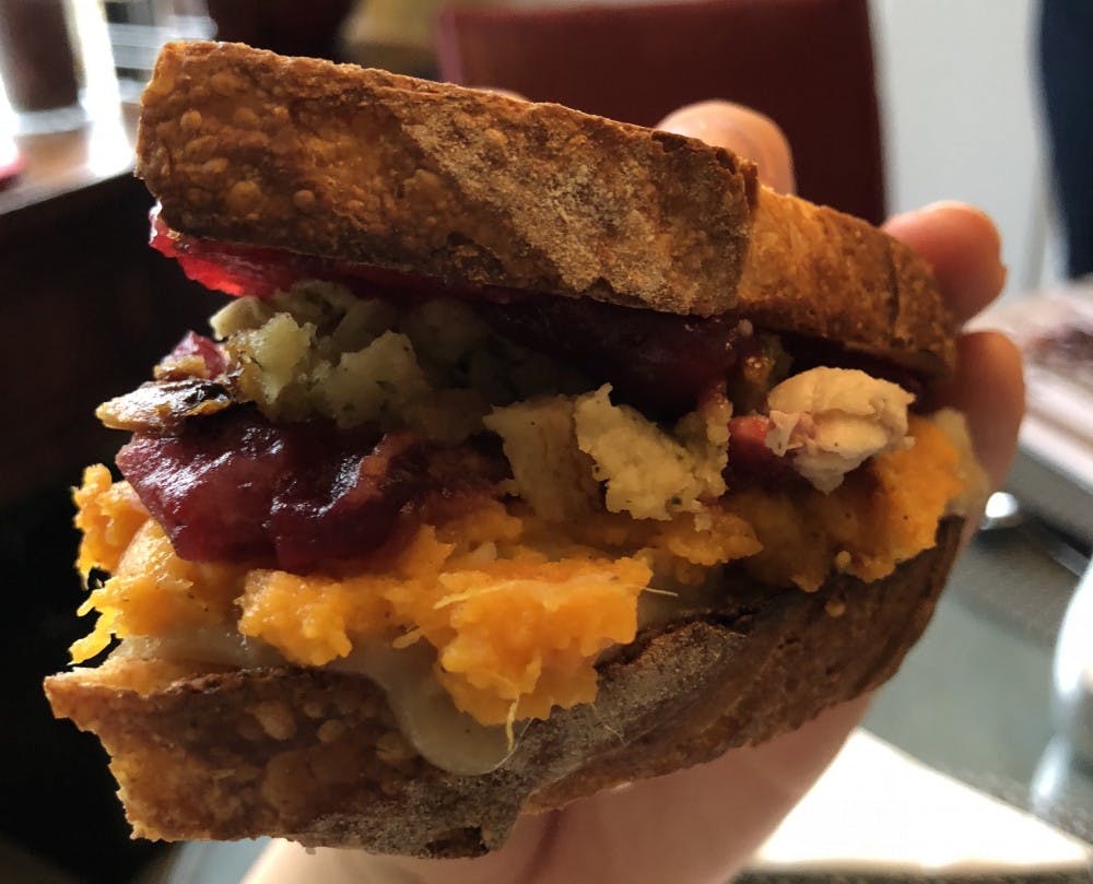 The ultimate Thanksgiving sandwich can be made from leftover stuffing, bread slices slathered with gravy and cranberry sauce, mashed potatoes, sweet potato casserole and turkey.&nbsp;