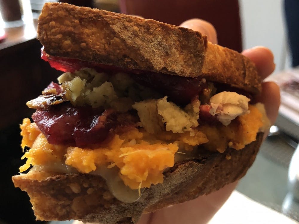 The ultimate Thanksgiving sandwich can be made from leftover stuffing, bread slices slathered with gravy and cranberry sauce, mashed potatoes, sweet potato casserole and turkey. 