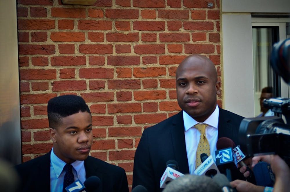 <p>Daniel Watkins (right), the lawyer for Martese Johnson (left), said releasing the report would have a positive public impact.</p>