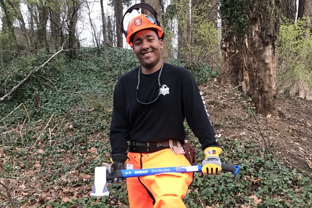<p>Tobi Addis, president of Virginia Woodsmen Team, works on improving local forests.&nbsp;</p>