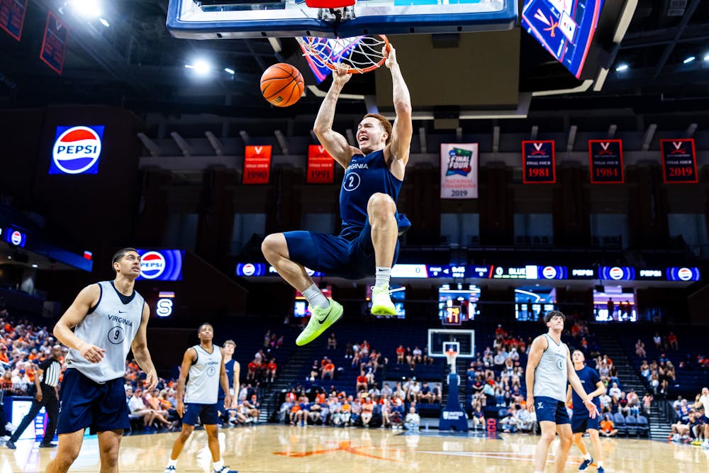 <p>Elijah Saunders hammers home a dunk during the Blue-White Scrimmage.</p>