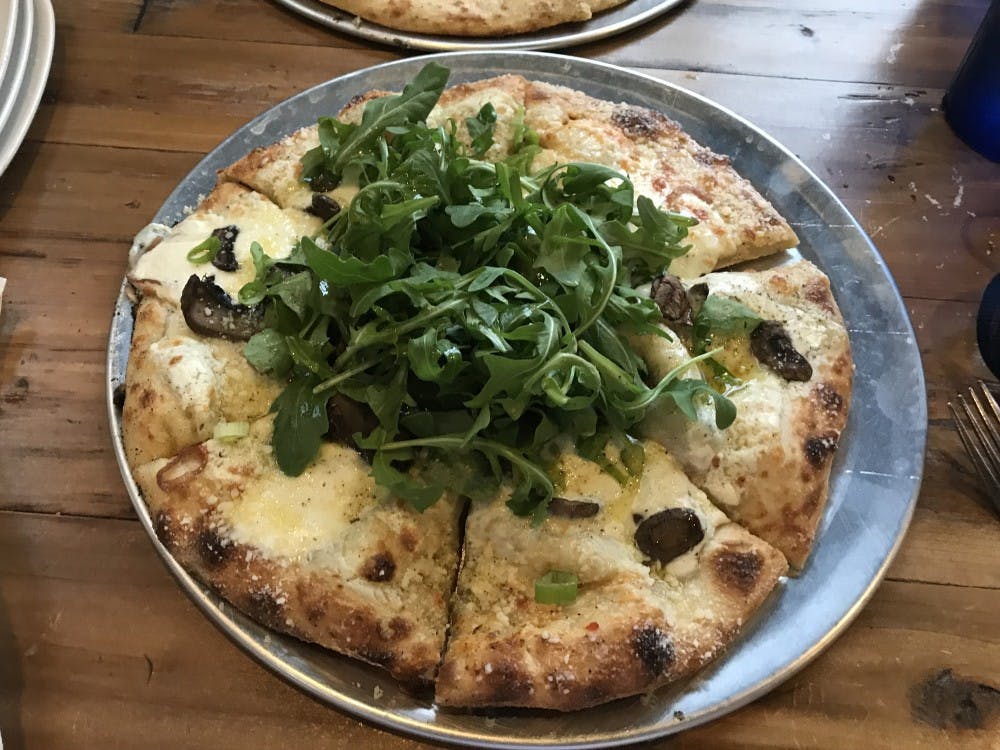 <p>I ordered the Funghitown pizza, which was a vegetarian pizza topped with mushrooms, caramelized onions, white sauce, mozzarella and arugula.</p>