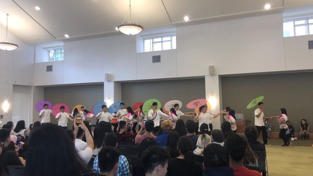 Vivid traditional Chinese umbrellas opened and closed to the beat of various styles of music as the smell of freshly-cooked Chinese food filled the air. 