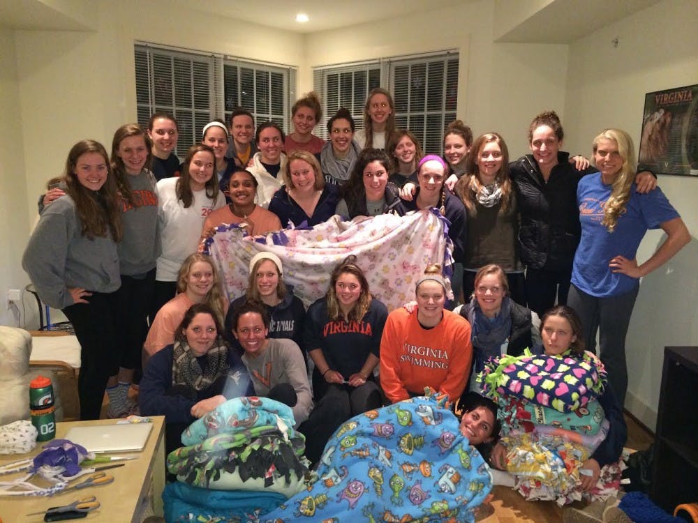 <p>The Women's Swimming and Diving team made blankets for the U.Va. Children's Hospital as part of their effort to support Cure4Cam, an organization raising awareness about humane treatments for childhood cancer patients. </p>