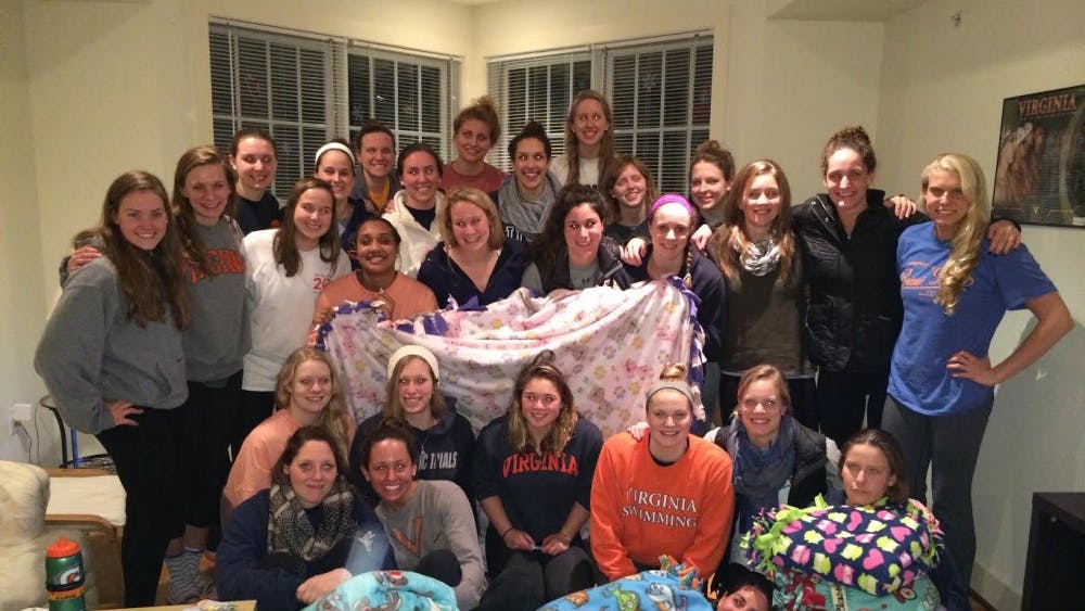The Women's Swimming and Diving team made blankets for the U.Va. Children's Hospital as part of their effort to support Cure4Cam, an organization raising awareness about humane treatments for childhood cancer patients.