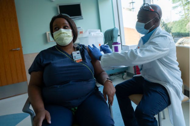 Courtesy to Sanjay Suchak/University of Virginia

Mesha Jones, Wound Ostomy RN at the U.Va. Health System, receives the COVID-19 vaccine