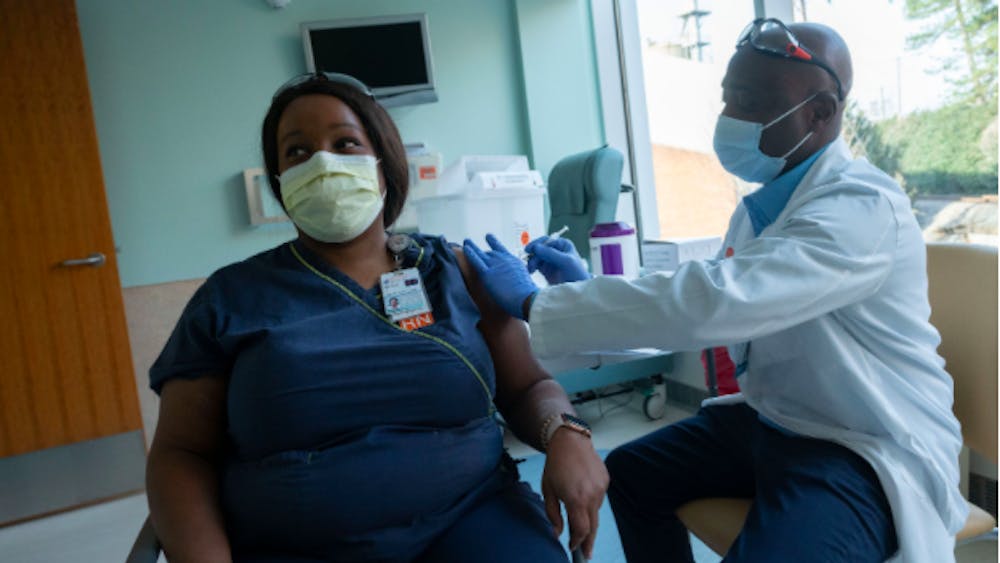 Courtesy to Sanjay Suchak/University of Virginia
Mesha Jones, Wound Ostomy RN at the U.Va. Health System, receives the COVID-19 vaccine