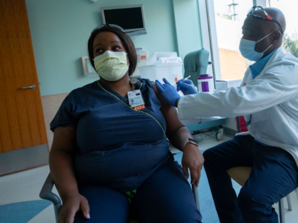 Courtesy to Sanjay Suchak/University of Virginia
Mesha Jones, Wound Ostomy RN at the U.Va. Health System, receives the COVID-19 vaccine