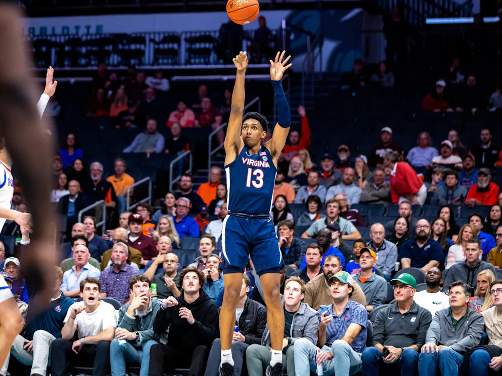 Dunn hoists up a three-point shot against Florida in 2023.