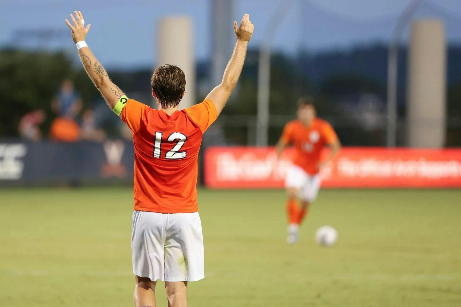 Albin Gashi, back turned, during Virginia's game Monday against American.