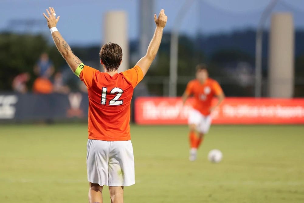<p>Albin Gashi, back turned, during Virginia's game Monday against American.</p>