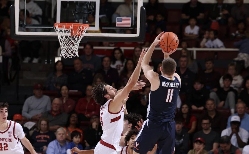 <p>Isaac McKneely, whose strong performance stoked Virginia early, rises for a shot.</p>