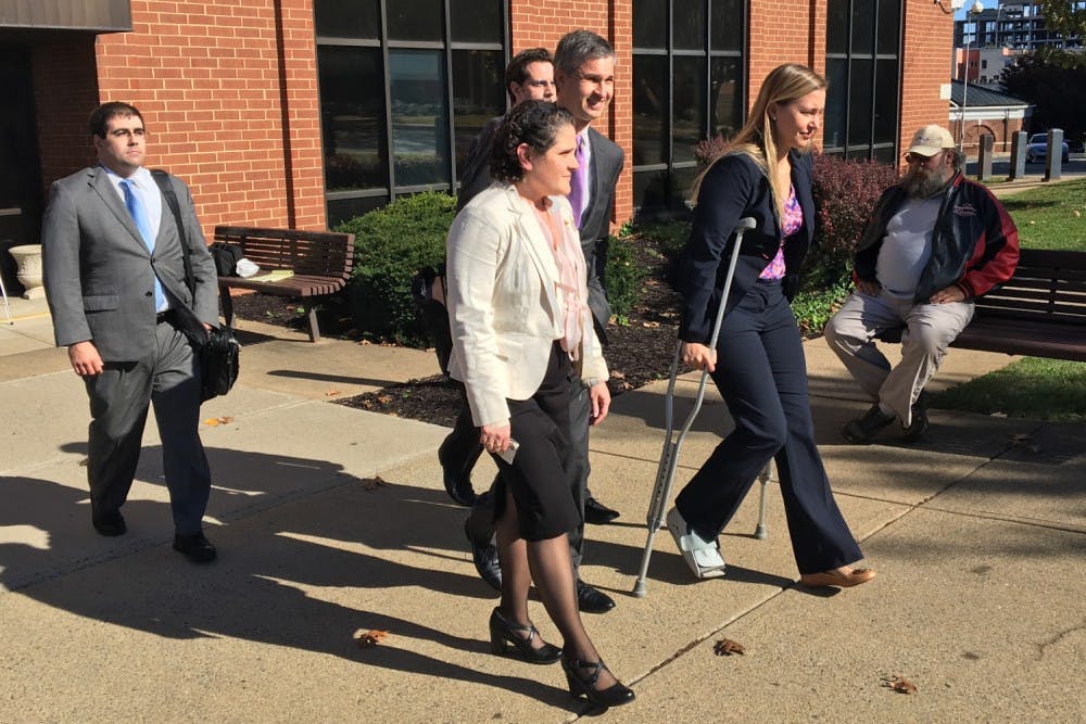 Eramo exits the courthouse after the jury finds in her favor.
