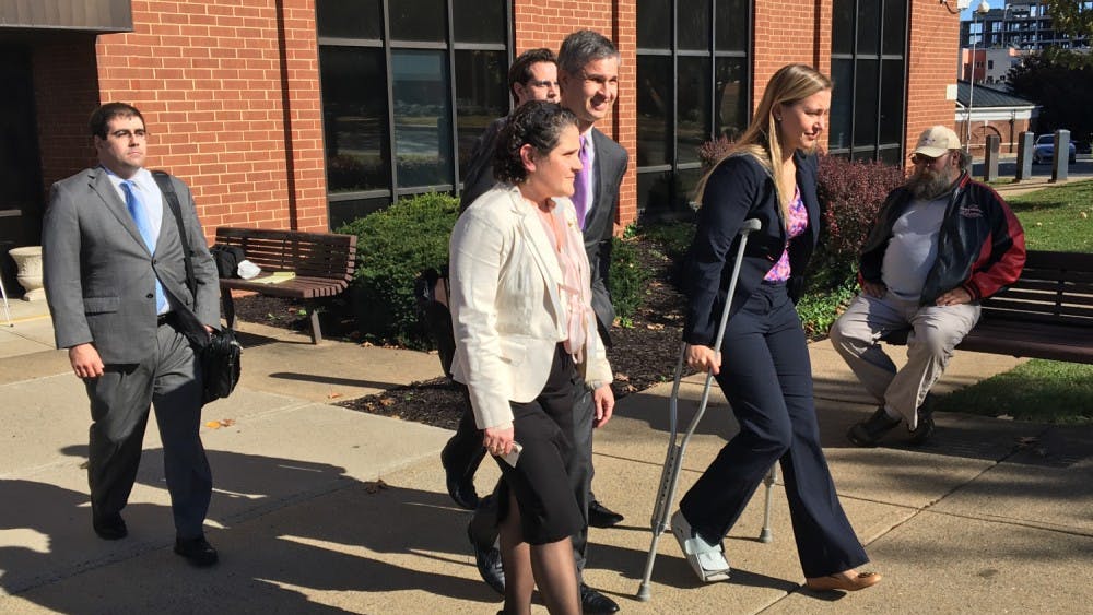 Eramo exits the courthouse after the jury finds in her favor.