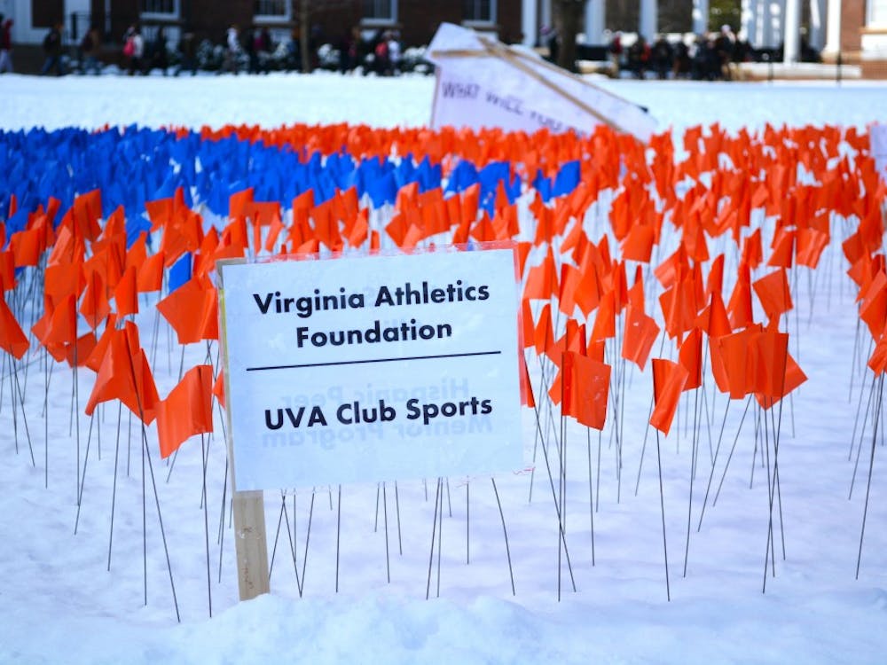 	The Fourth Year Trustees set up a display on the Lawn (above) with Orange flags representing the percent of the class that has pledged gifts.