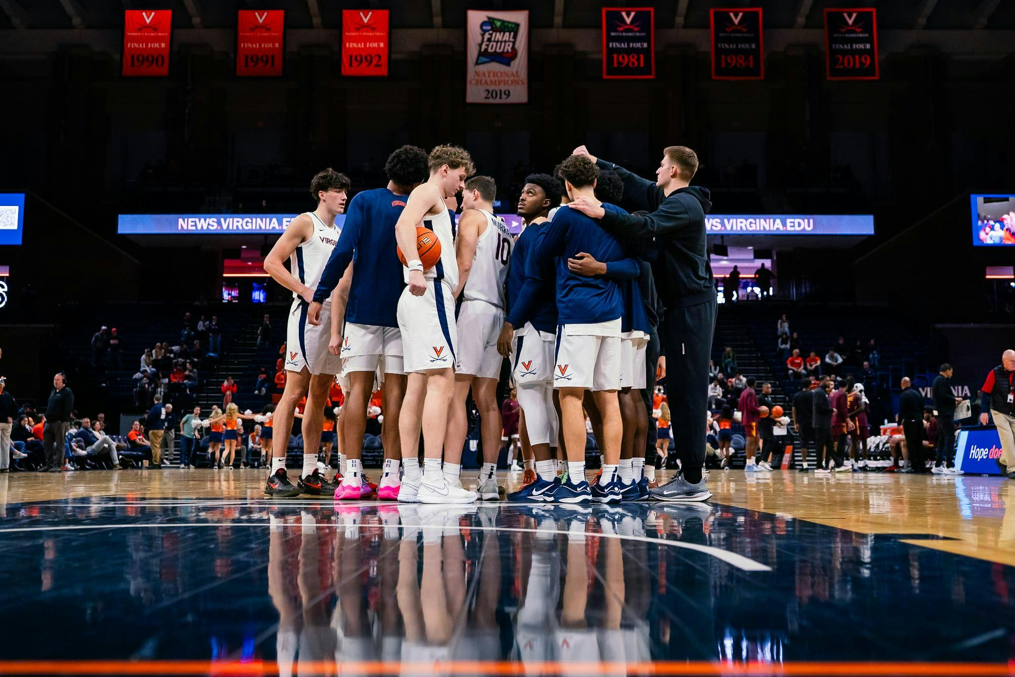 Virginia huddles on the court before a home game earlier this season.