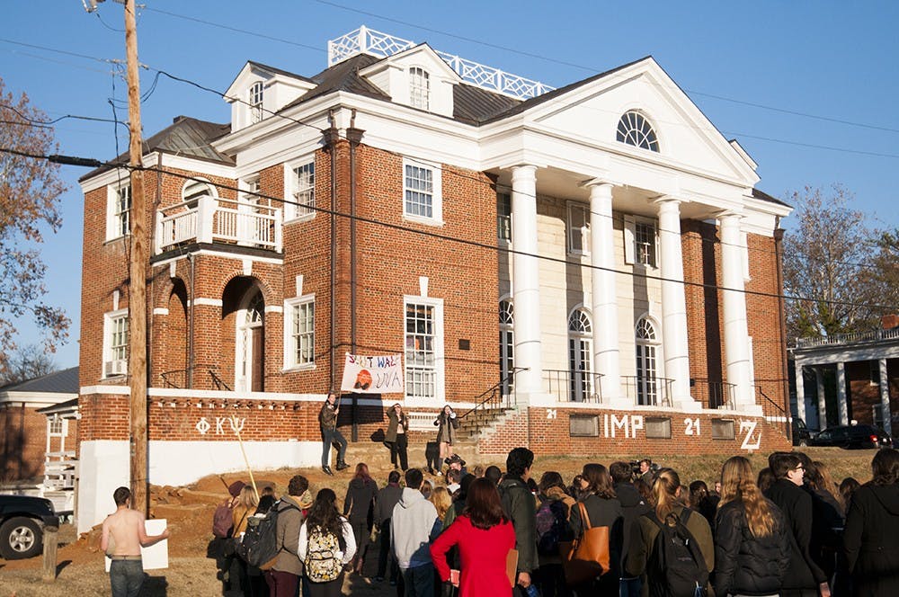 <p>Students gathered outside of the Phi Kappa Psi house to protest the fraternity following the release of the Rolling Stone article in November.</p>