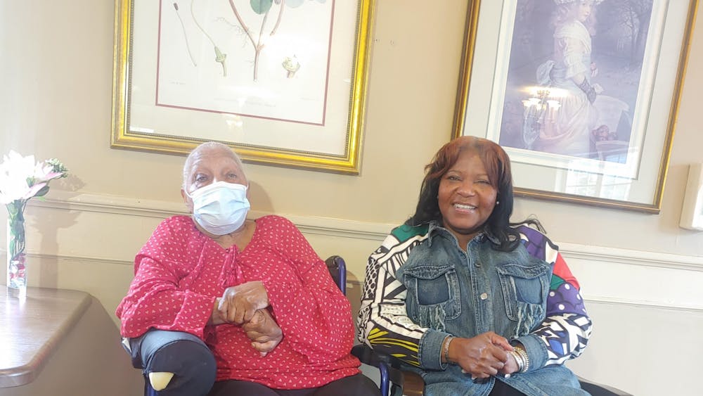 Wendy Cooper and her mother, an Alzheimer's patient, sitting together.