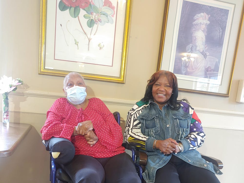 Wendy Cooper and her mother, an Alzheimer's patient, sitting together.