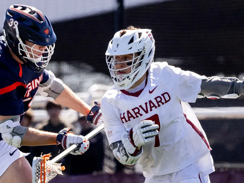 Senior defender Cole Kastner pushes a Harvard attacker