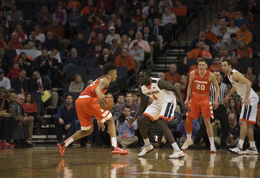 Virginia sophomore guard Mariel Shayok guards Syracuse freshman guard Malachi Richardson,&nbsp;who scored 23 points Sunday against the Cavaliers.