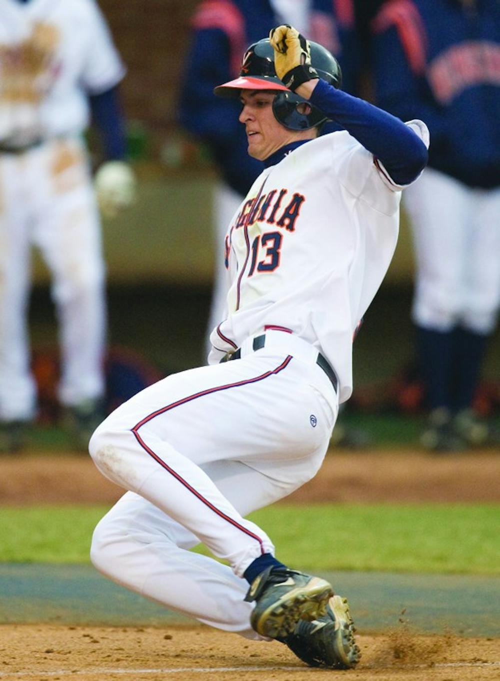 Virginia Cavaliers OF Jarrett Parker (13) slides in to home to score a run.  The #16 ranked Virginia Cavaliers baseball team defeated the Siena Saints 17-2 at the University of Virginia's Davenport Field in Charlottesville, VA on February 29, 2008.