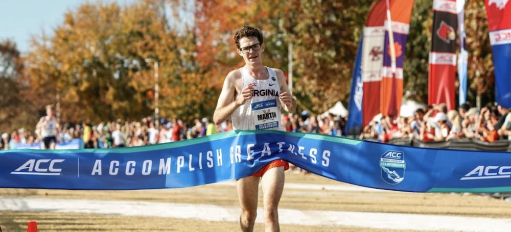 <p>Martin crosses the finish line for Virginia's first individual ACC men's title since 2010.</p>