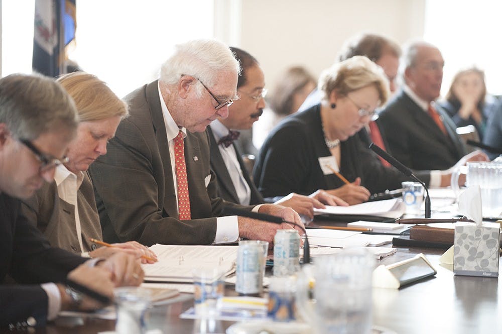 	Members of the Board of Visitors, including Rector George Martin, above center, met in the Rotunda.