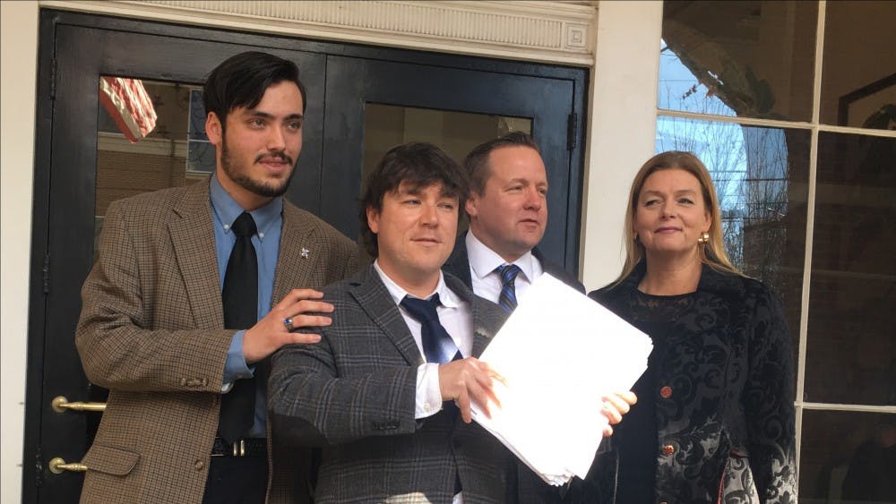 Kessler (center) could serve up to 12 months in jail, receive a maximum fine of $2,500 or both.