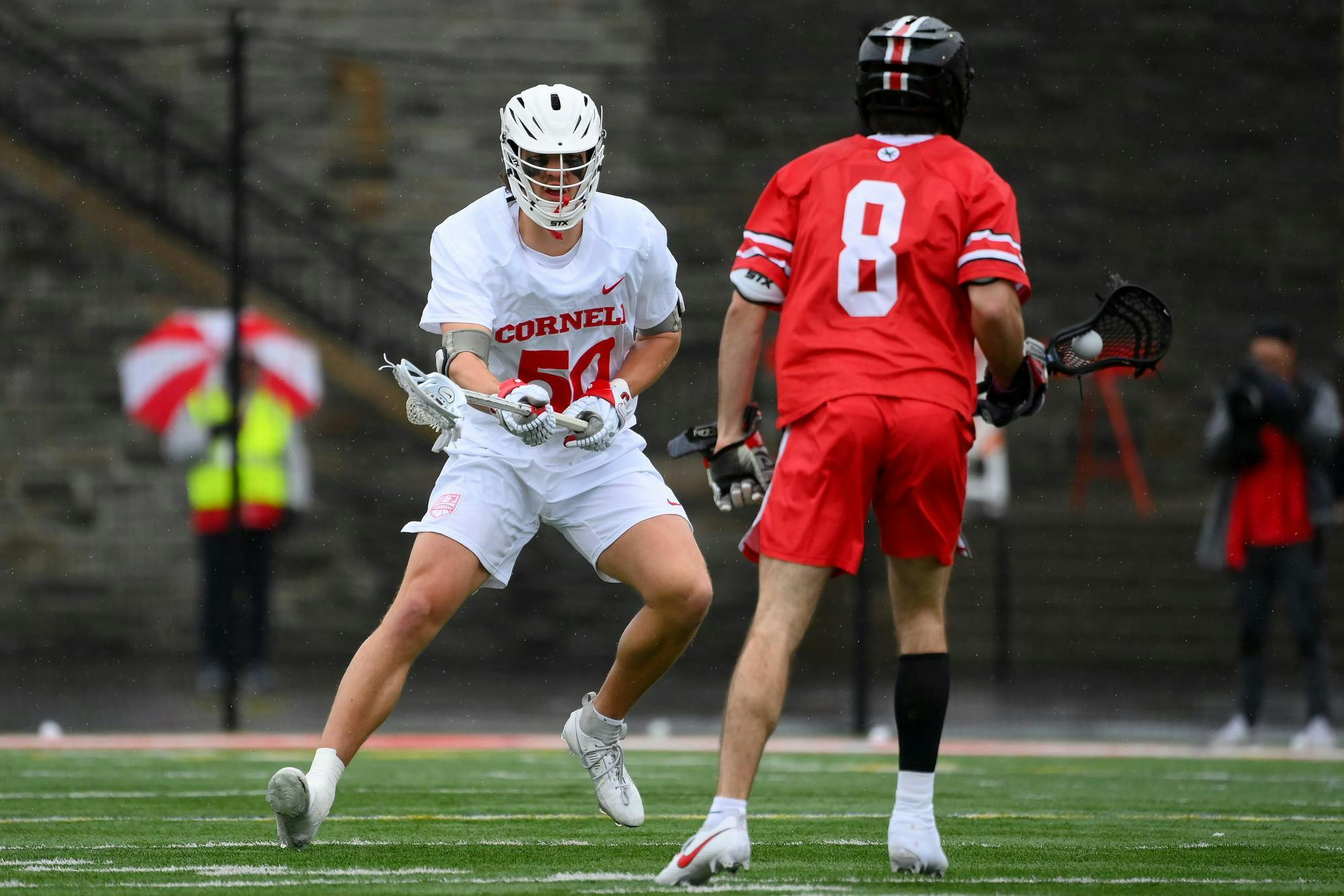 Wallace, during his senior season at Cornell, bares down on an Ohio State attacker.