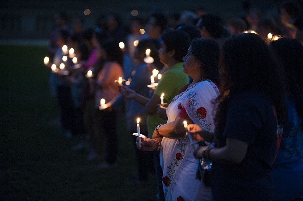 Students, faculty and community members gathered in the amphitheater Sunday night to honor victims of the earthquake in Nepal and support those affected by the tragedy.