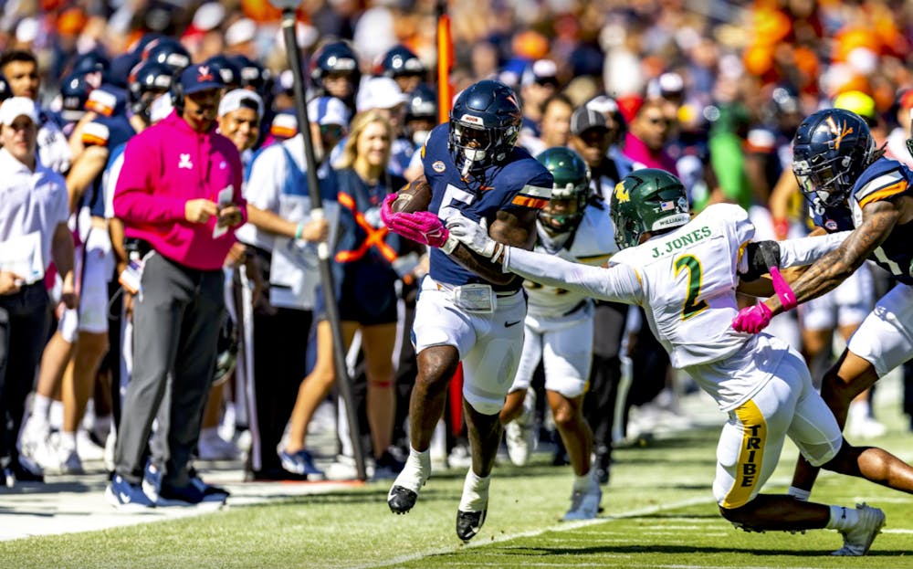 Kobe Pace sprints for a first down against William & Mary in last season's breast cancer awareness game.